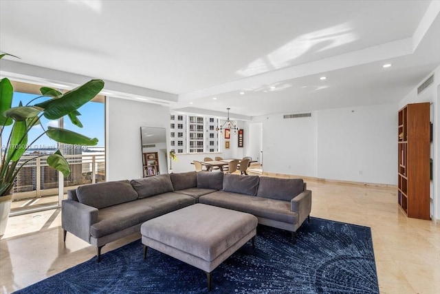 living room with recessed lighting, visible vents, and baseboards