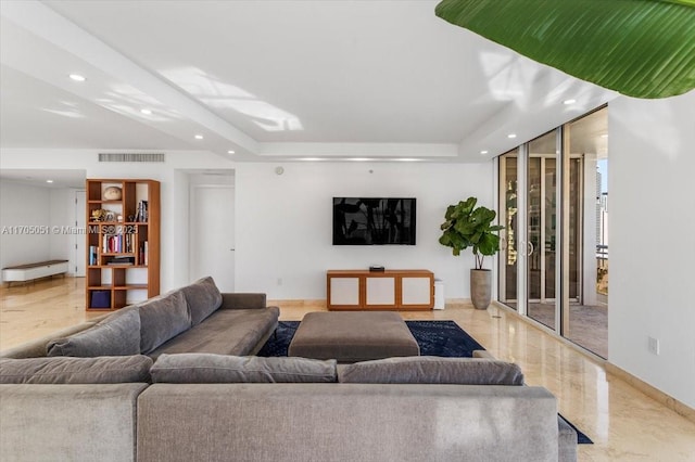 living area with marble finish floor, visible vents, a raised ceiling, and recessed lighting