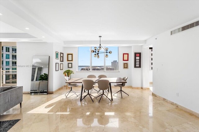 dining area featuring a notable chandelier