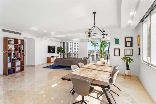 dining space featuring an inviting chandelier, baseboards, and visible vents