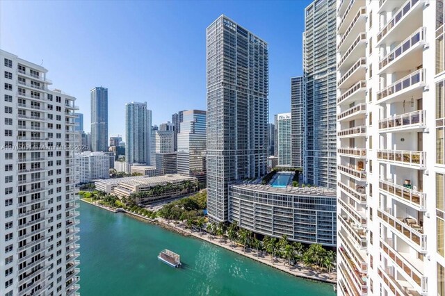 property's view of city featuring a water view