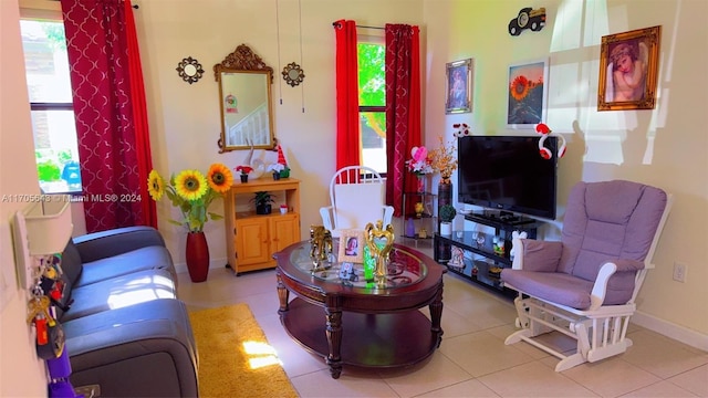 tiled living room featuring a healthy amount of sunlight