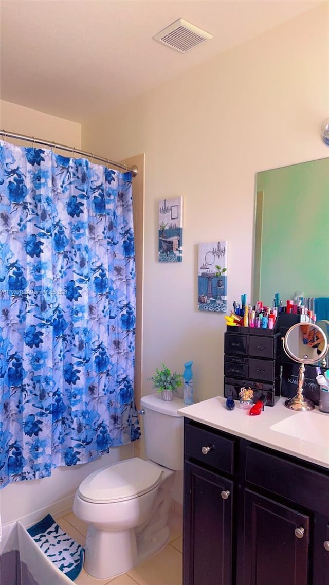 full bathroom featuring toilet, shower / bath combination with curtain, vanity, and tile patterned floors