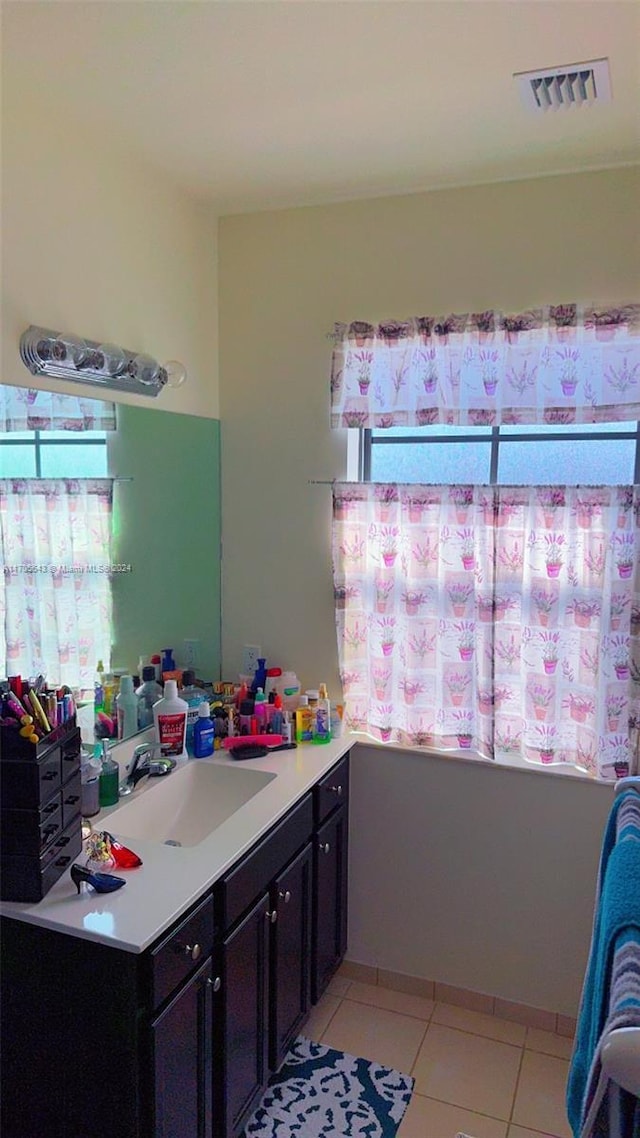 bathroom featuring tile patterned floors and vanity