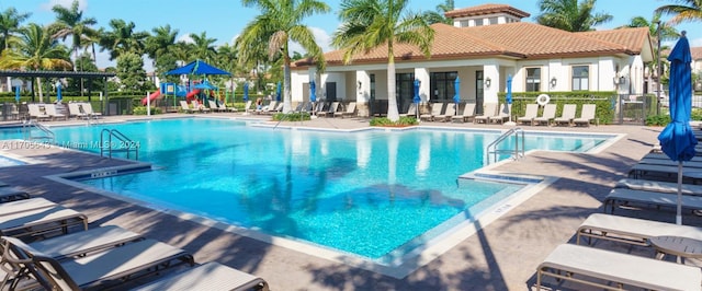 view of swimming pool featuring a patio area