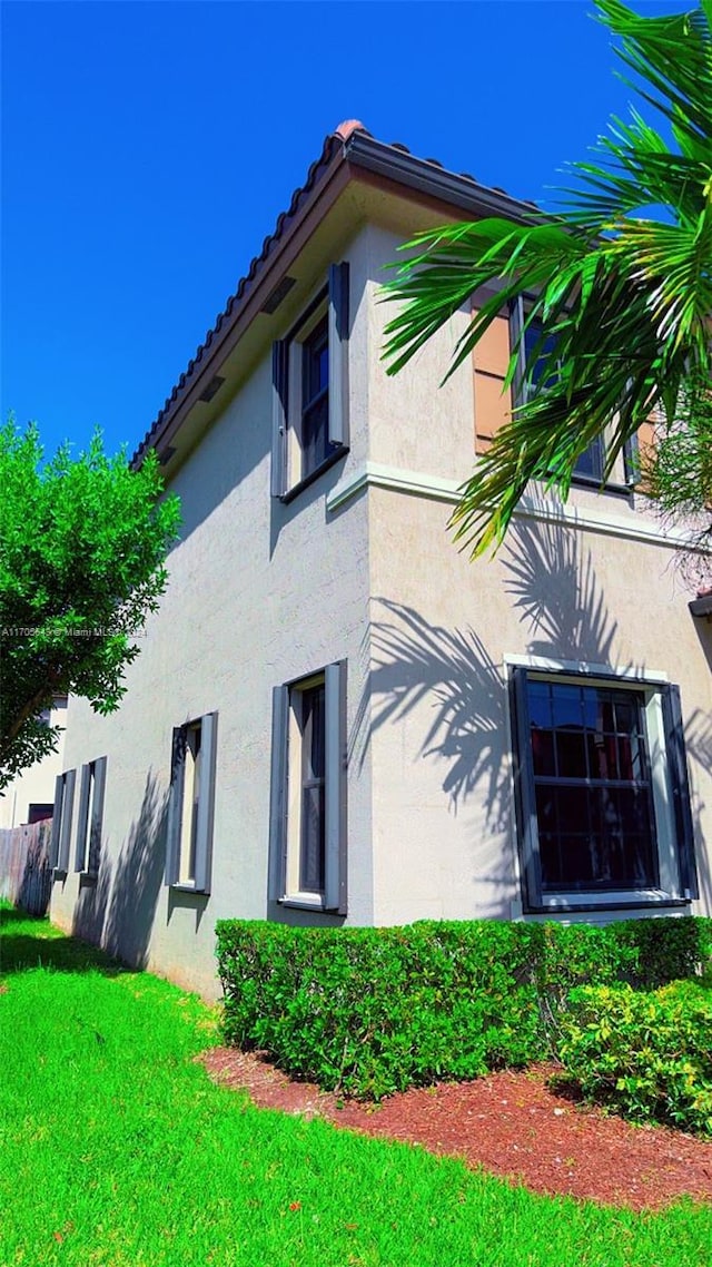 view of home's exterior featuring a lawn