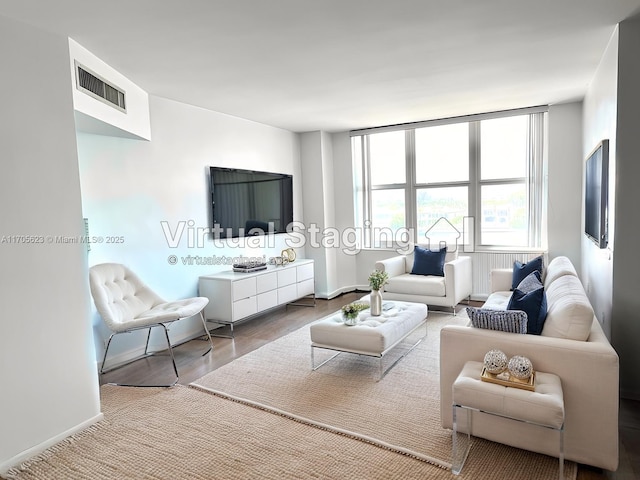 4747 Collins Ave Unit 503, Miami Beach, FL 33140 - living room featuring baseboards and wood finished floors