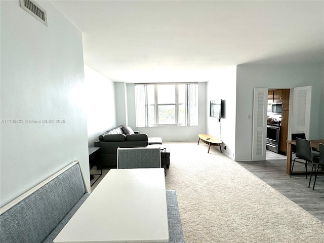 4747 Collins Ave Unit 503, Miami Beach, FL 33140 - living room with wood finished floors and baseboards
