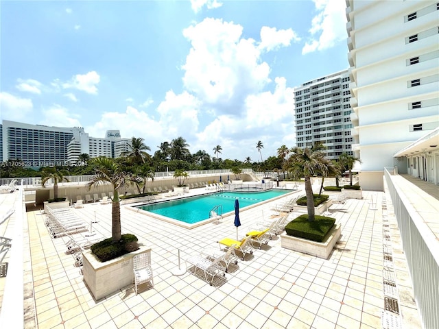 view of swimming pool with a patio area