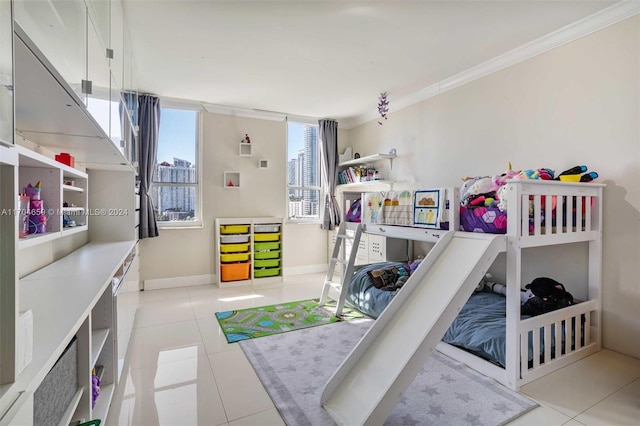 bedroom with crown molding and light tile patterned floors