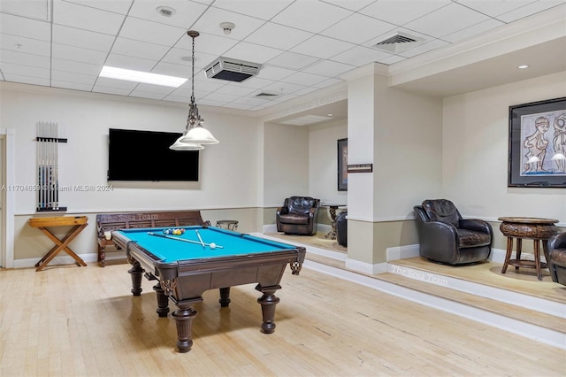 recreation room with hardwood / wood-style floors, crown molding, and billiards