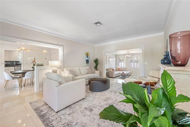 tiled living room with ornamental molding and a notable chandelier