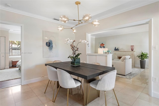 tiled dining space with a chandelier and ornamental molding