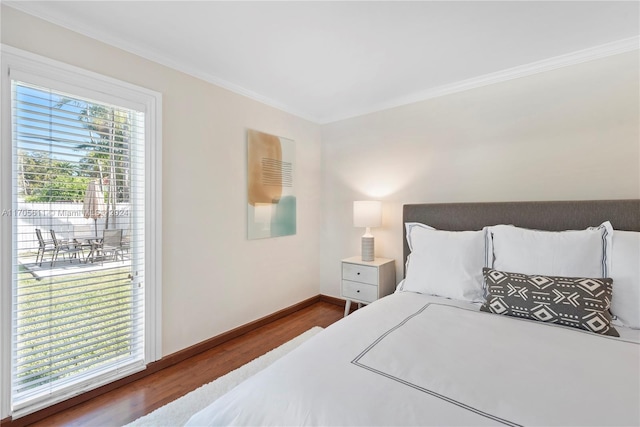 bedroom featuring wood-type flooring and crown molding