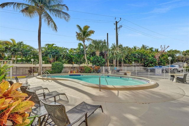 view of swimming pool featuring a patio