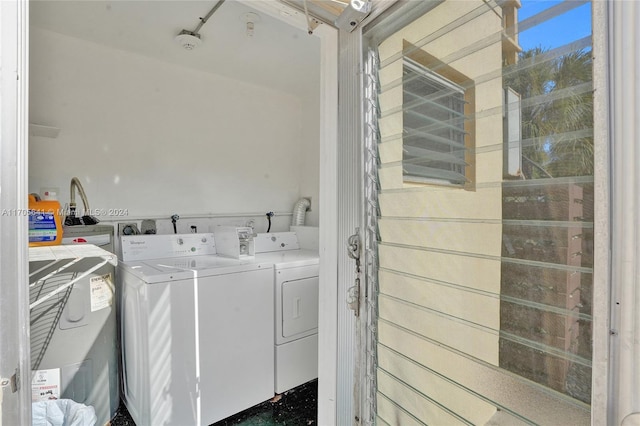 laundry area featuring washing machine and clothes dryer