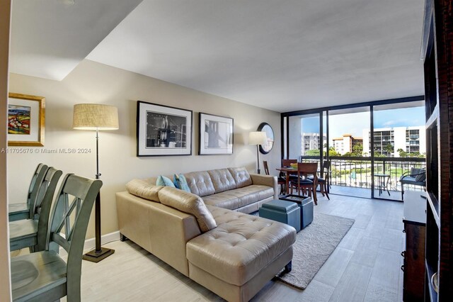 2687 N Ocean Blvd Unit 402-G, Boca Raton, FL 33431 - living room featuring light wood-style floors and floor to ceiling windows