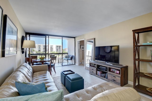 living room featuring a wall of windows