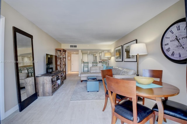 2687 N Ocean Blvd Unit 402-G, Boca Raton, FL 33431 - dining area with light wood finished floors