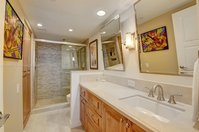 2687 N Ocean Blvd Unit 402-G, Boca Raton, FL 33431 - full bathroom with toilet, a stall shower, vanity, and recessed lighting