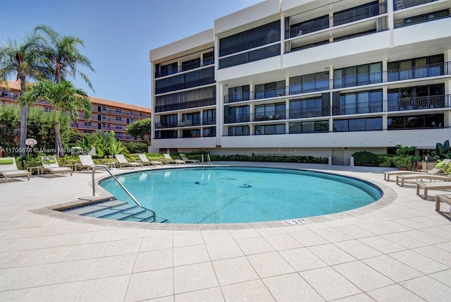 view of pool featuring a patio