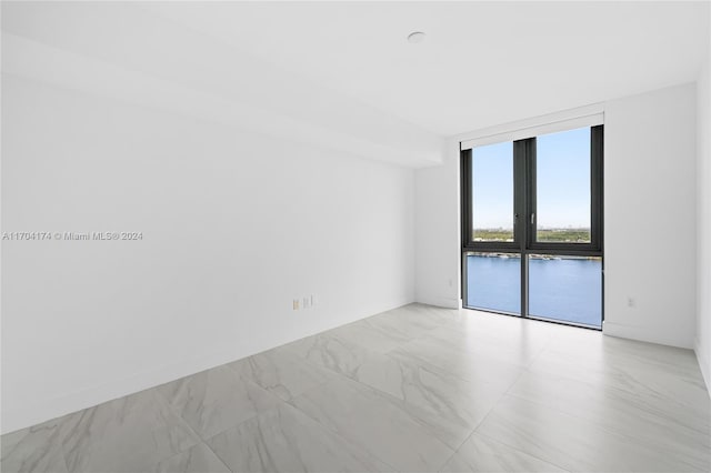 spare room featuring expansive windows