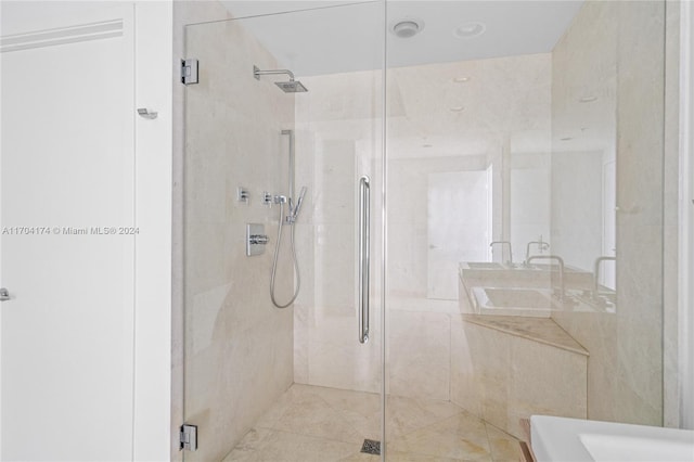 bathroom with double sink and walk in shower