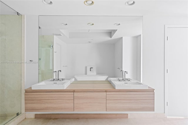 bathroom with vanity and an enclosed shower