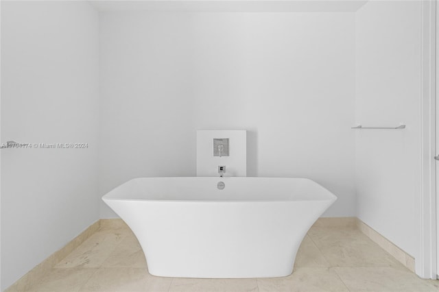 bathroom featuring tile patterned flooring and a bathtub