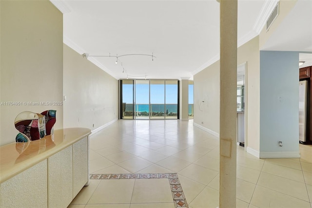 20281 E Country Club Dr Unit 2104, Aventura, FL 33180 - empty room with ornamental molding, rail lighting, light tile patterned floors, floor to ceiling windows, and baseboards