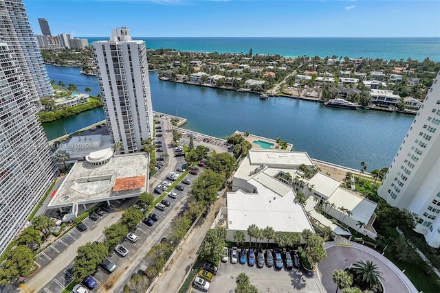20281 E Country Club Dr Unit 2104, Aventura, FL 33180 - unfurnished living room featuring floor to ceiling windows, light tile patterned flooring, a water view, baseboards, and rail lighting