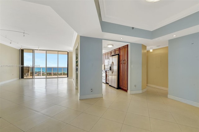 20281 E Country Club Dr Unit 2104, Aventura, FL 33180 - spare room with baseboards, crown molding, light tile patterned floors, a tray ceiling, and recessed lighting
