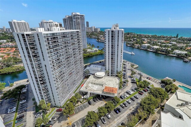 20281 E Country Club Dr Unit 2104, Aventura, FL 33180 - unfurnished bedroom featuring ornamental molding, light carpet, and baseboards