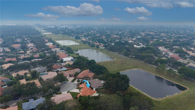 aerial view with a residential view and a water view