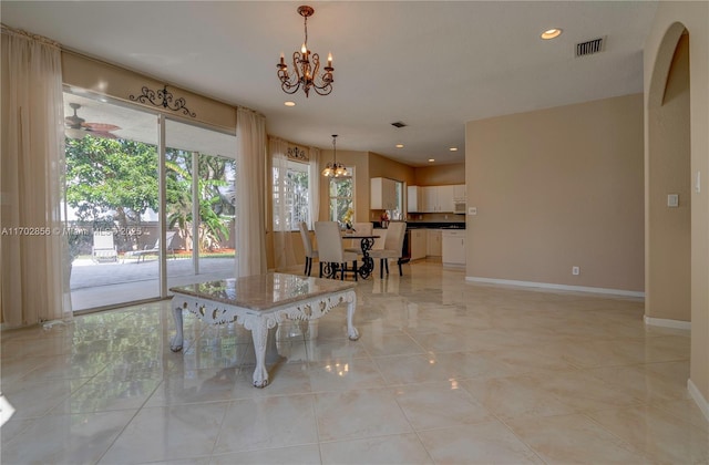 dining space with ceiling fan with notable chandelier, recessed lighting, visible vents, and baseboards