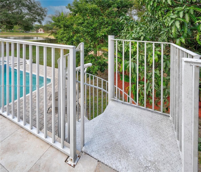 view of gate featuring a fenced in pool