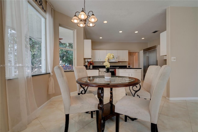 dining space featuring light tile patterned floors, recessed lighting, visible vents, and baseboards