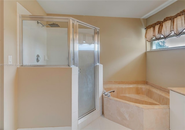 full bath featuring a stall shower and a garden tub