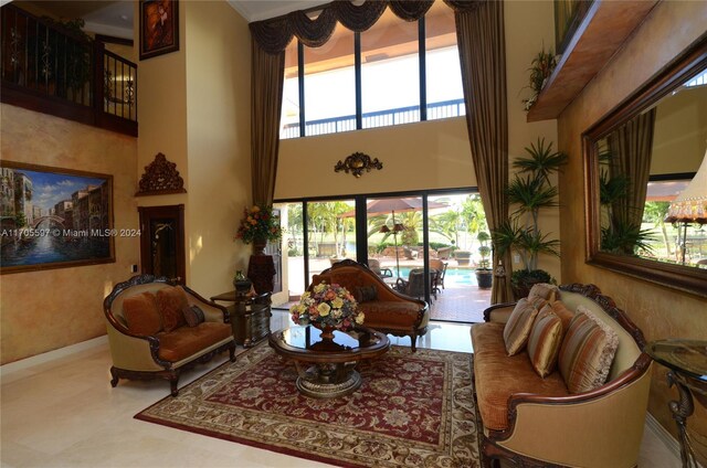 12040 N Eagle Trace Blvd N, Coral Springs, FL 33071 - living room featuring a high ceiling and baseboards