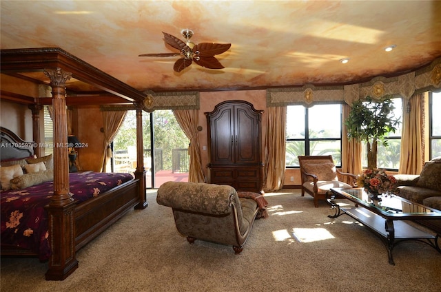 bedroom featuring carpet, ceiling fan, access to outside, and multiple windows