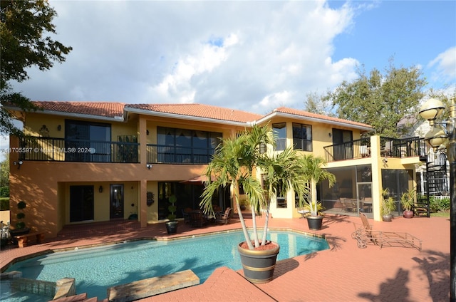 view of pool featuring a patio area