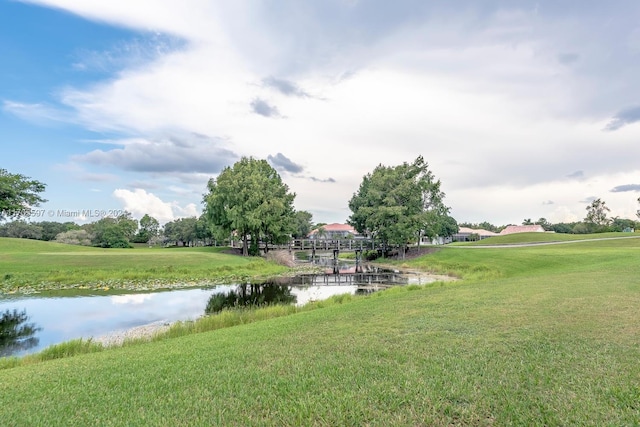12040 N Eagle Trace Blvd N, Coral Springs, FL 33071 - view of community featuring a water view and a yard