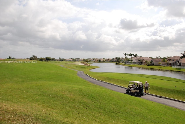 12040 N Eagle Trace Blvd N, Coral Springs, FL 33071 - view of home's community featuring a water view, a lawn, view of golf course, and a residential view