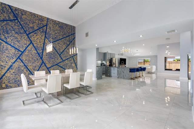 unfurnished dining area featuring a high ceiling