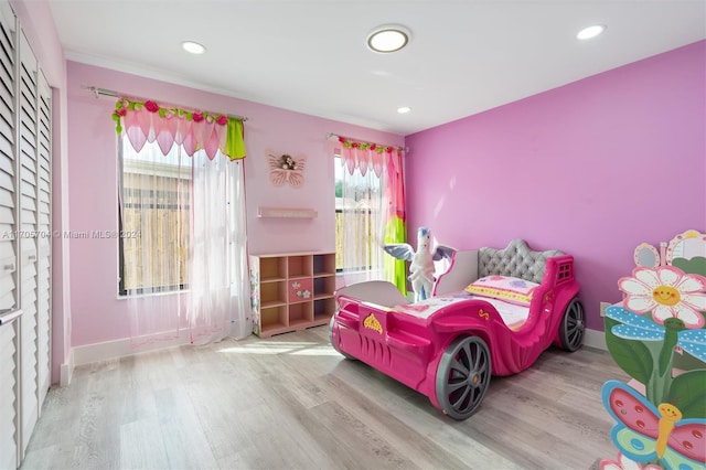 bedroom with light wood-type flooring