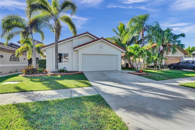 view of front of home featuring a garage and a front yard