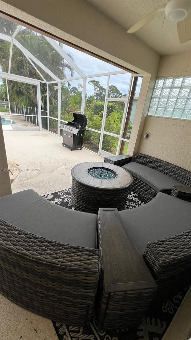 view of patio with a pool, ceiling fan, and grilling area