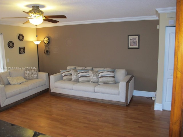 living room with hardwood / wood-style flooring, ceiling fan, and ornamental molding