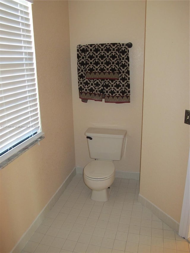 bathroom featuring tile patterned floors and toilet