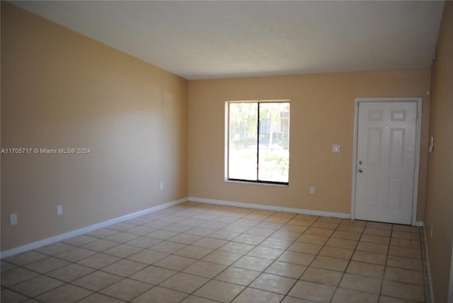 spare room featuring light tile patterned floors